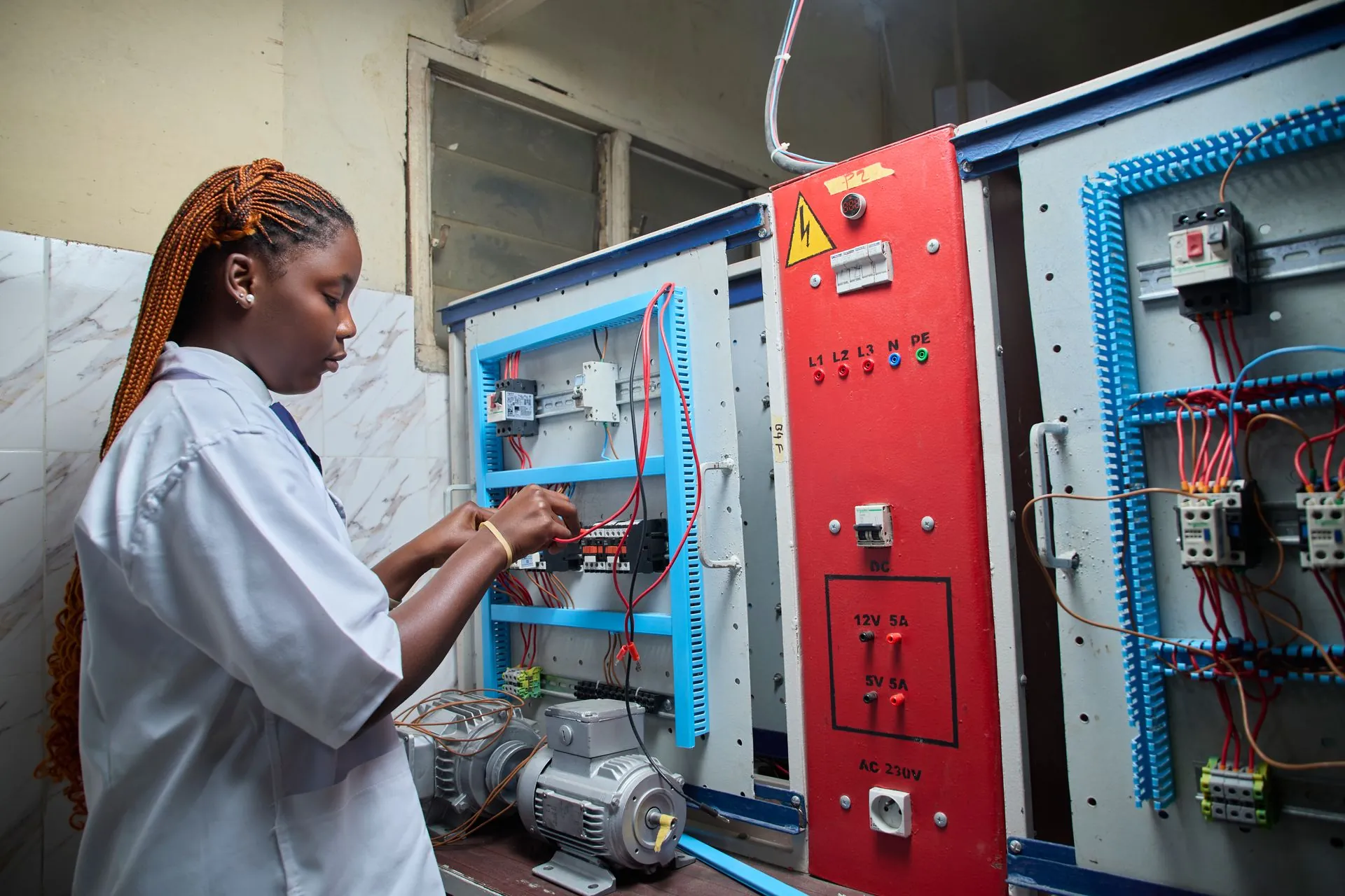 Technician working on an instrumentation control panel