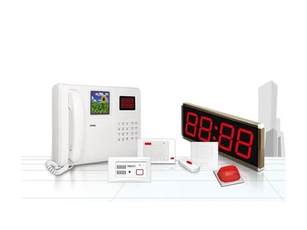 Nurse call ward console with bedside call points and a corridor display