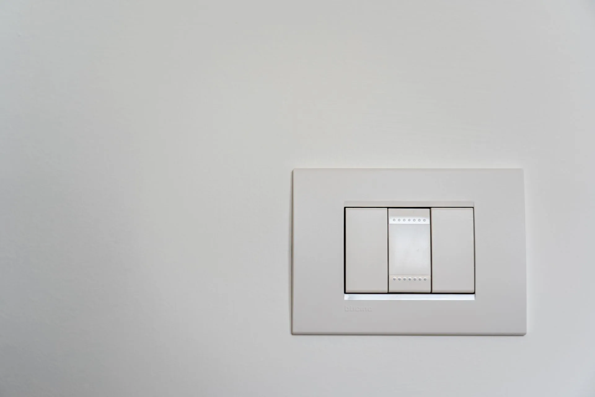 Modular light switch on a clean painted wall