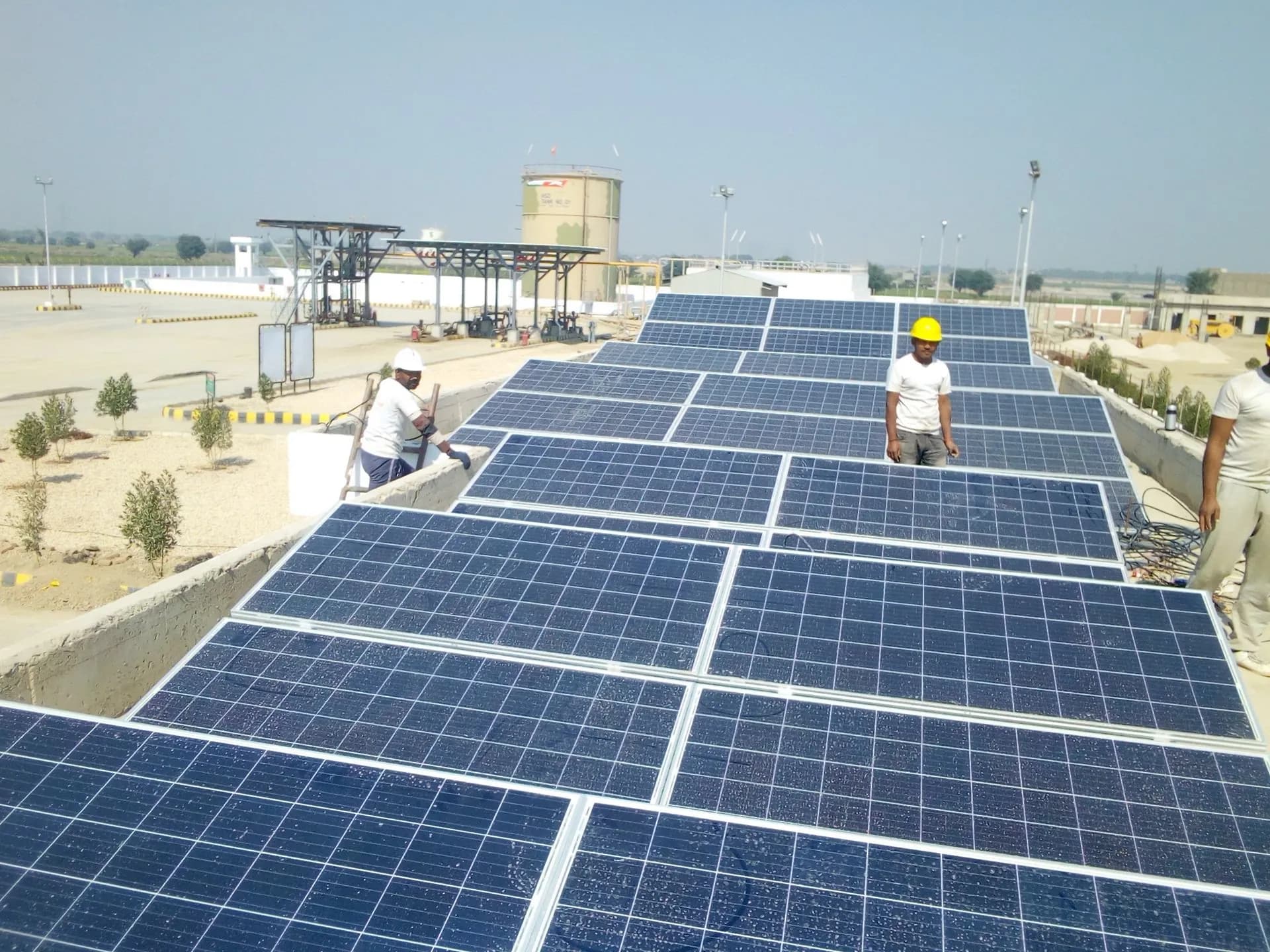 Technicians installing photovoltaic modules
