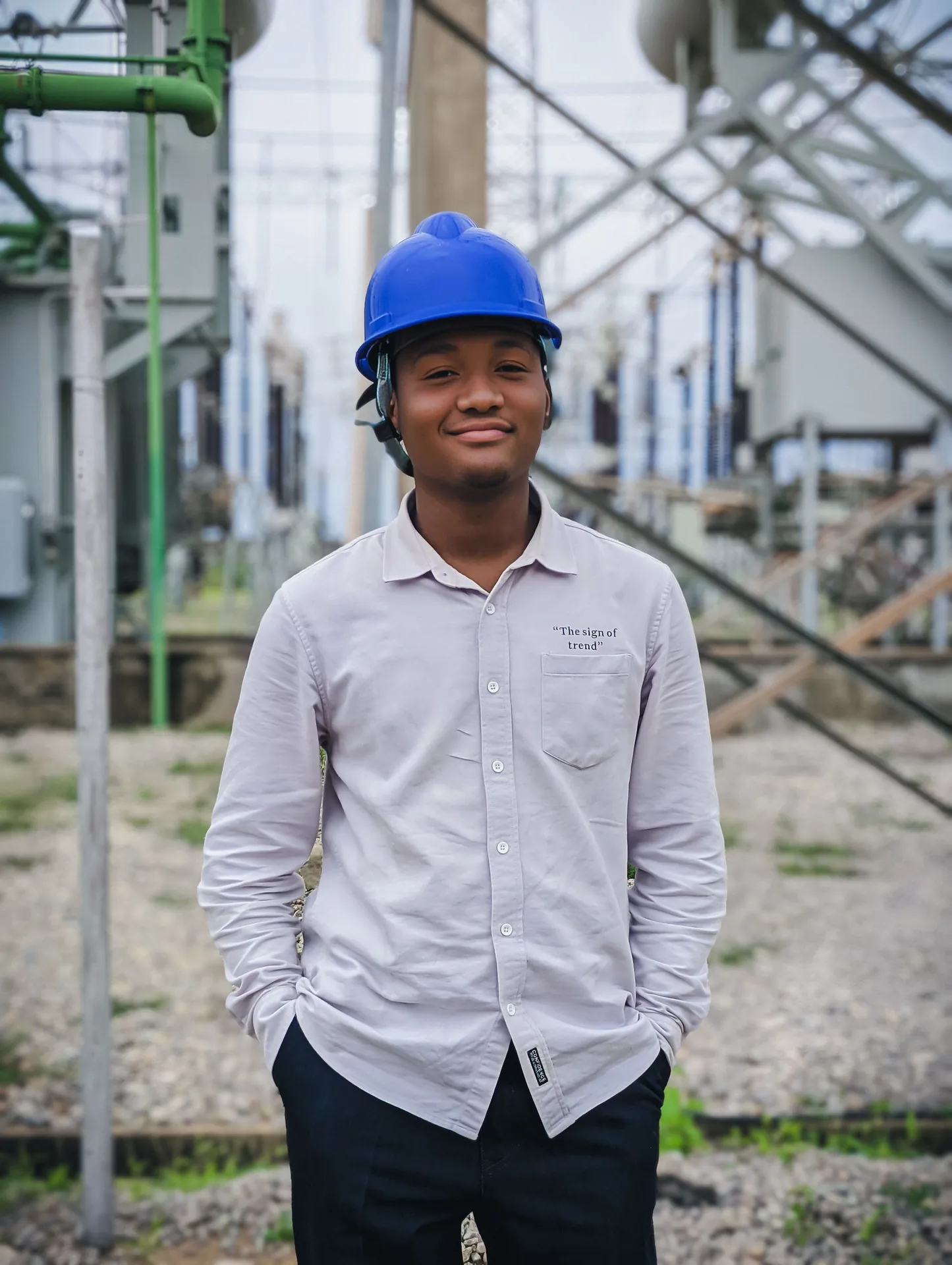 Young engineer inspecting an outdoor electrical substation