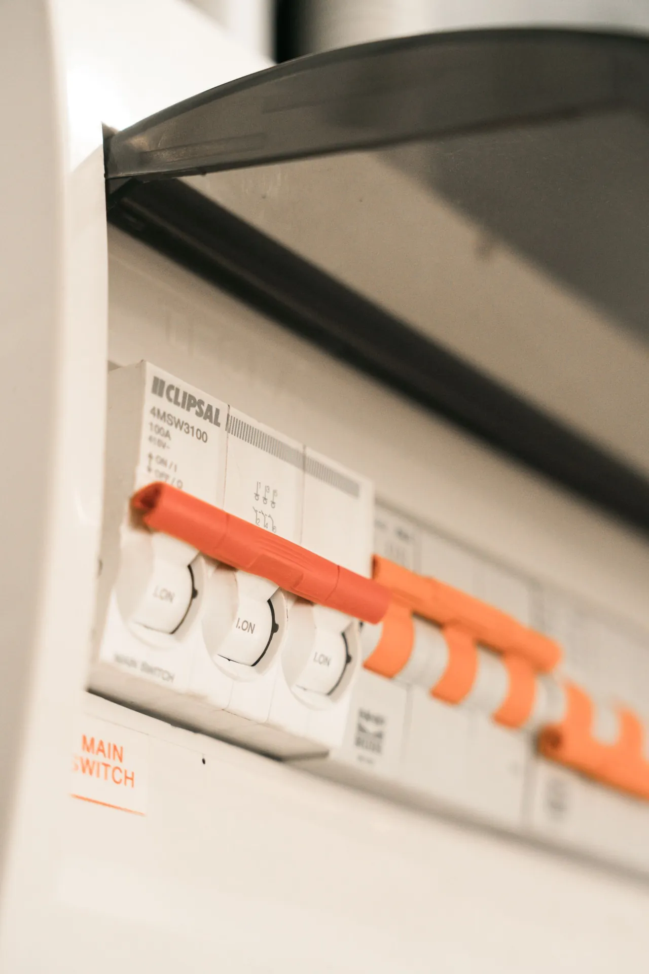 Close-up of circuit breakers in a capacitor control panel