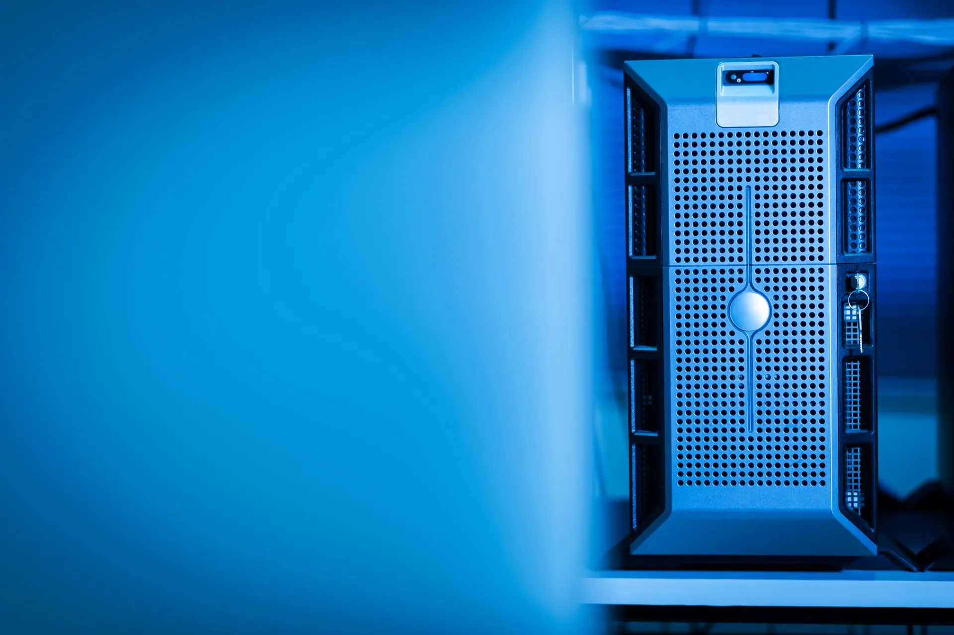 Server unit in a blue-lit data centre aisle
