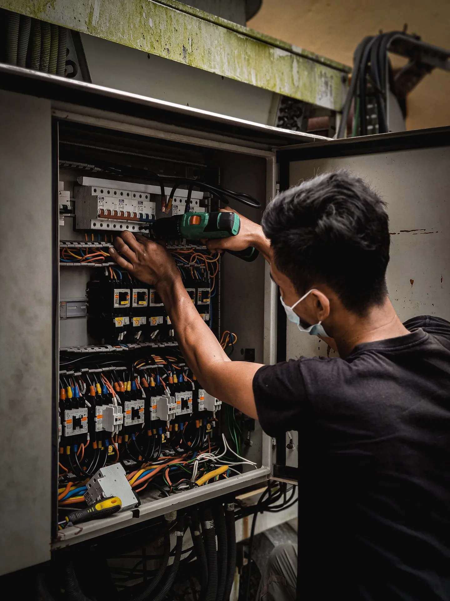 Hand operating a circuit breaker switch